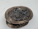 a silver box that has a picture of a horse on it