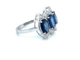 an image of a blue sapphire and diamond ring