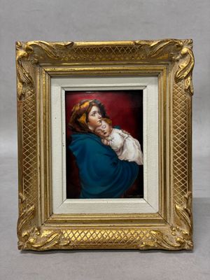 a painting of a woman holding a baby in a gold frame