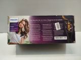 packaging of a philips hair dryer sitting on top of a white counter