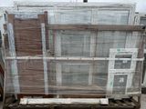 a pallet full of wood and glass on a pallet