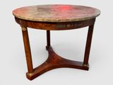 une image représentant une table ronde avec un plateau en marbre et des pieds en bois