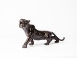 figurine représentant un lion sur fond blanc