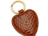 a close up of a heart shaped keychain on a white background