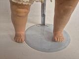 a small doll that is standing on a table