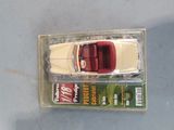 a toy car that is sitting on top of a box