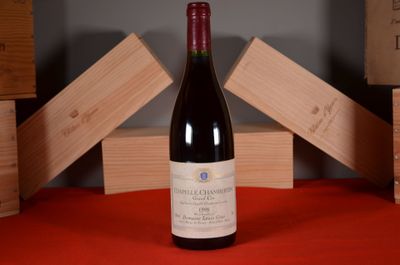 a bottle of red wine sitting on a table
