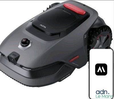 an image of a robotic lawn mower with a remote control