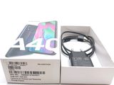 an image of a box with a phone in it and a charger attached to it