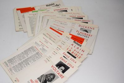 several pamphlets are stacked on top of each other on a table