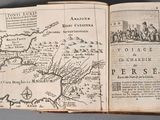 an open book with a map on it on a table