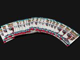 a close up of a bunch of playing cards on a table