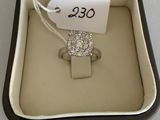a ring in a box with a price tag on it