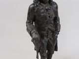 pair of bronze figurines of a man and a woman