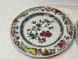 a plate and a bowl sitting on a table