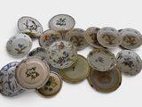 a lot of plates that are sitting on a table