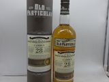 une image d'une bouteille de whisky à côté d'une boîte en carton