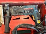 a red box with tools in it on a table