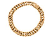 a gold bracelet with a curb on a white background