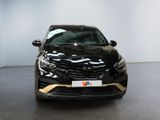 the front of a black car is parked in a showroom