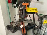 a pile of tools on a table in a garage