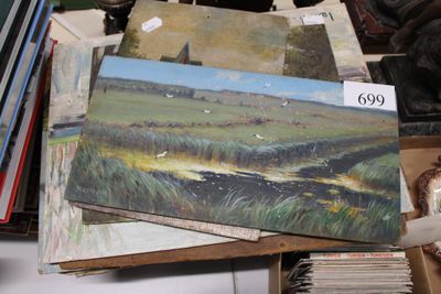 a lot of paintings that are on a table