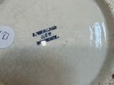 a close up of a white bowl with a tag on it
