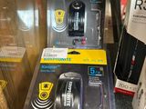 two boxes of remotes sitting on a table