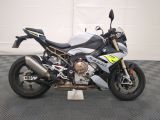 a motorcycle that is parked on a checkered floor