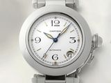 a close up of a watch on a white surface