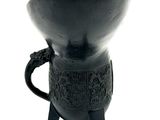 a black vase with a handle on a white background