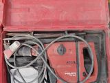 a red tool box with tools in it on the floor