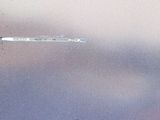 a glass ball that is floating in the water