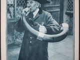 an old black and white photo of a man in a hat holding a large horn