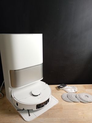 a white machine that is sitting on a wooden table