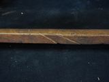 a close up of a baseball bat on a black surface