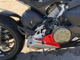 a close up of a motorcycle parked in a parking lot