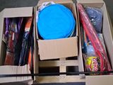 a cardboard box filled with assorted items on the floor