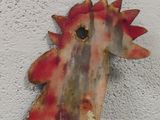 a rusted metal sea horse on a wall