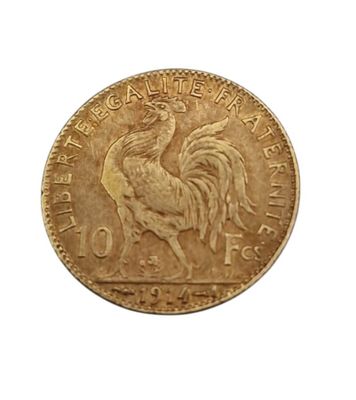 Gros plan sur une pièce d'or ornée d'un coq