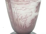 a glass vase with a picture of a man and a dog on it