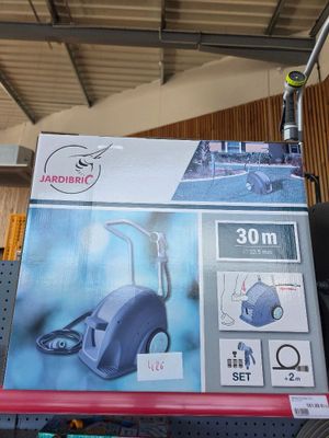 a box of vacuum cleaners sitting on a shelf in a store