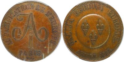 a close up of a coin with the letters a and b on it