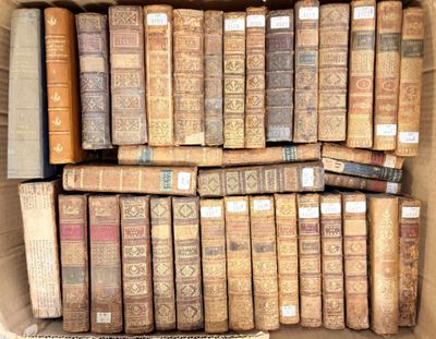 a box full of old books sitting on a table