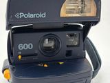 a polaroid camera sitting on top of a table