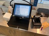 a laptop computer sitting on top of a counter