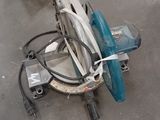 two circular saws on the floor next to each other