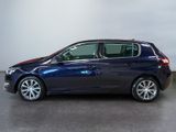 the blue car is parked in a large room with a white wall