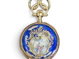 une montre de poche bleue et dorée sur laquelle figure une image