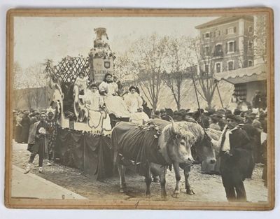 a vintage photo of a group of people riding on a horse